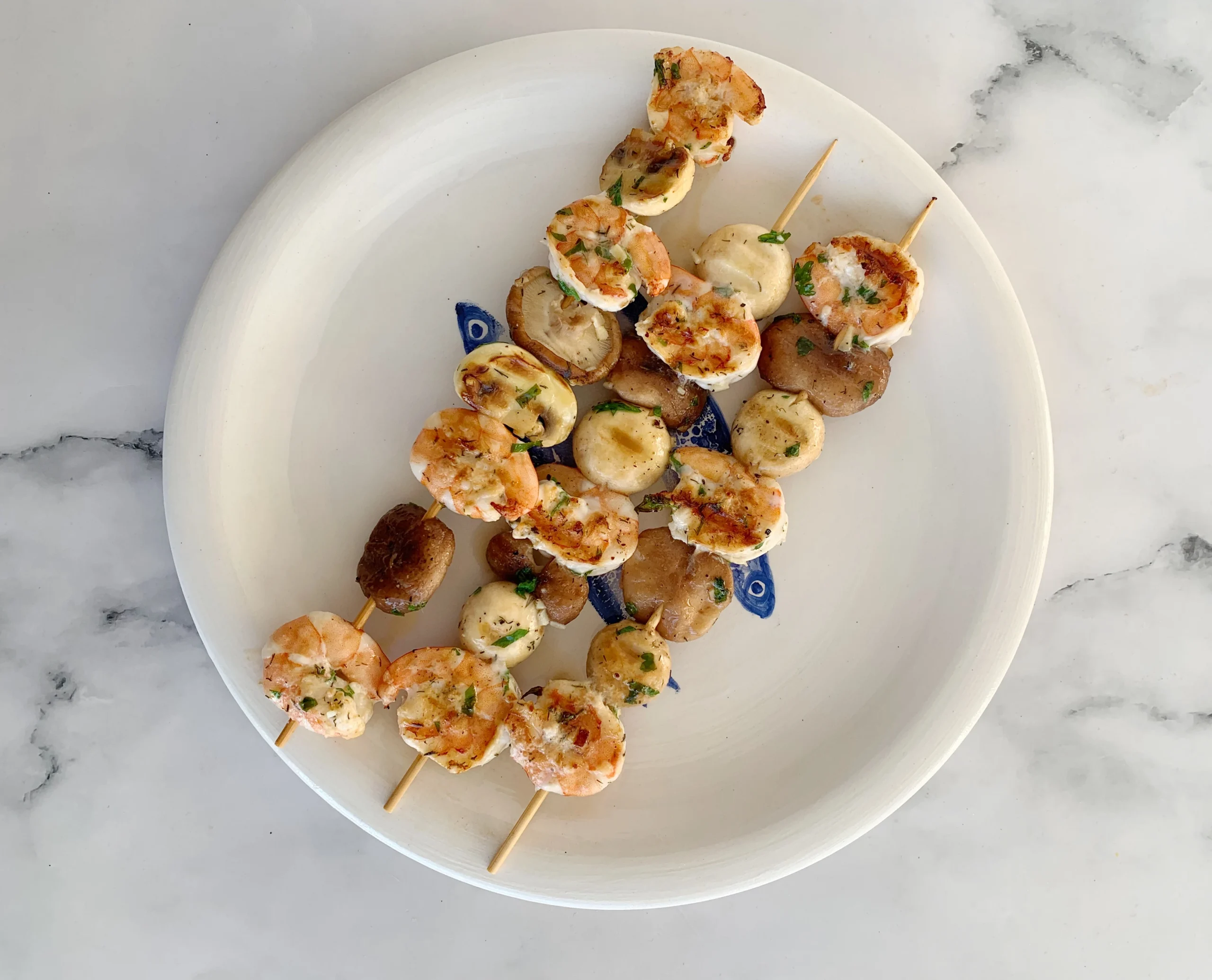 Brochetas de langostinos y setas