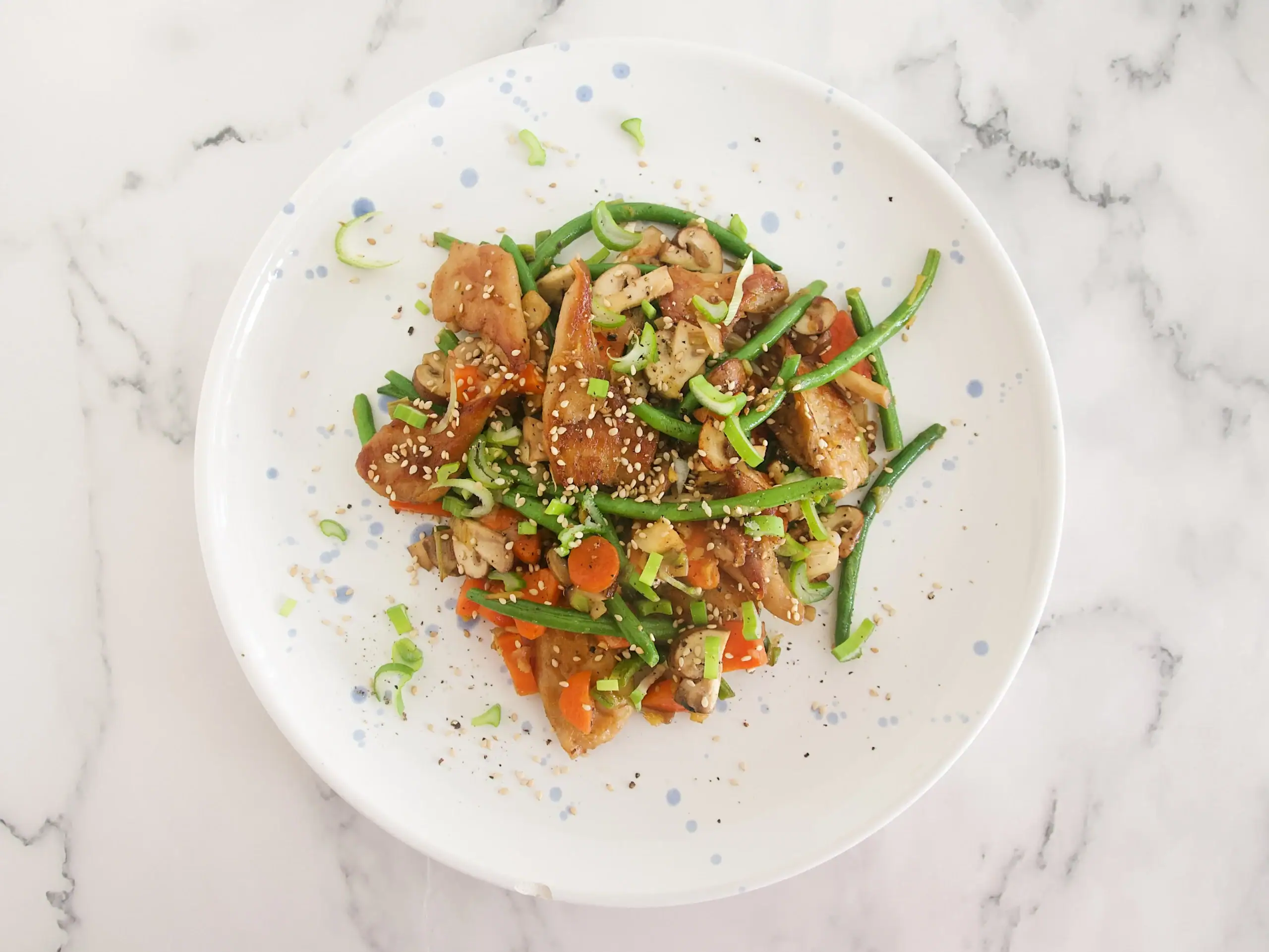 Salteado de Heura® con verduras, ajo y jengibre 